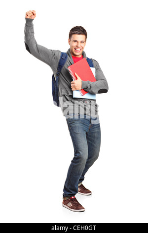 In voller Länge Portrait eines glücklichen Studenten mit Büchern isoliert auf weißem Hintergrund Stockfoto