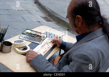 Kunsthandwerk. Florenz. Mann skizziert Kunst. Straßenkünstler bei der Arbeit. Italien Stockfoto