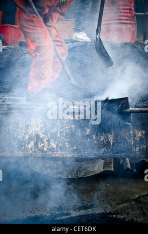 unban Städtebau Asphalt Arbeiter Stockfoto