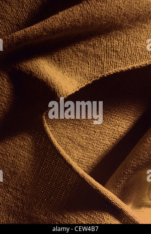 Gelbe, goldfarbene Textur aus Textil aus nächster Nähe Stockfoto