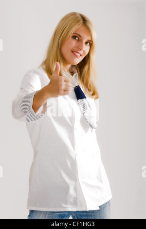 Positive Mädchen in Arbeitskleidung Stockfoto