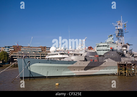 HMS Belfast, Teil des Imperial War Museum, auf der Themse zwischen London Bridge und der Tower Bridge. HMS Belfast ist die Tanne Stockfoto