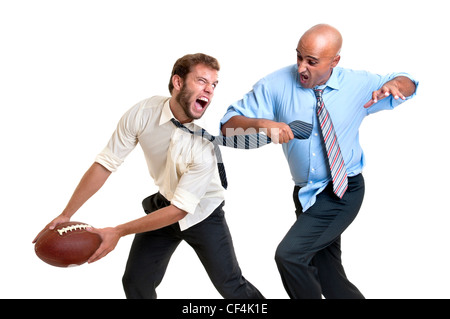 Unternehmer spielen Rugby isoliert in weiß Stockfoto