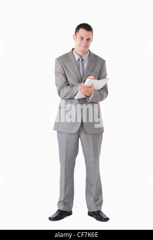 Porträt eines lächelnden Geschäftsmann Notizen Stockfoto