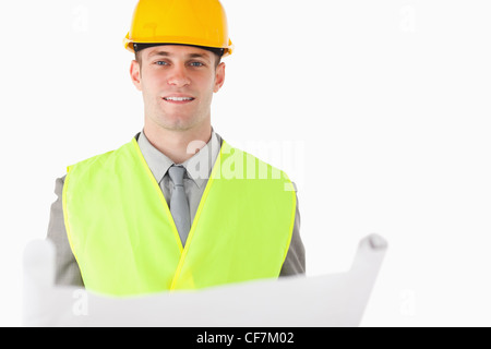 Builder halten einen plan Stockfoto