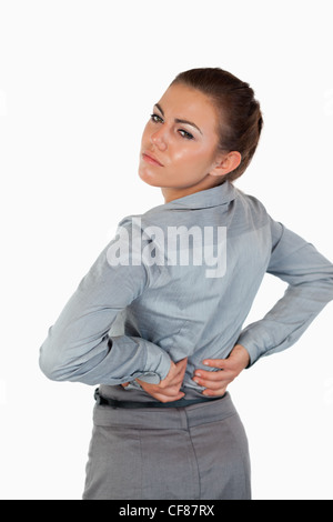 Porträt von müde Geschäftsfrau mit Rückenschmerzen Stockfoto