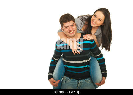 Happy man geben Huckepack auf seine Freundinnen und Spaß zusammen isoliert auf weißem Hintergrund Stockfoto