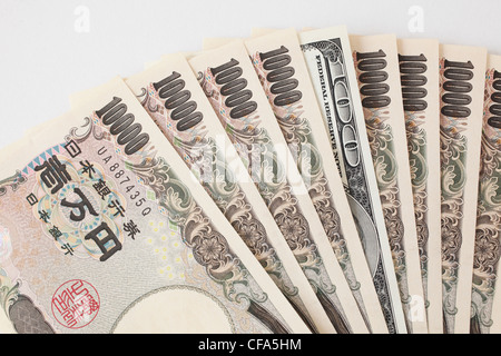 Japanease 10000 Yen und 100 Dollar. Stockfoto