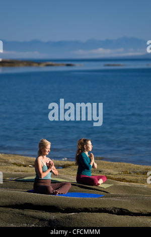 Yogpractioners Denman Island meditieren entspannen Lotus Stockfoto