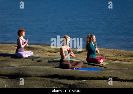 Yogpractioners Denman Island meditieren entspannen Lotus Stockfoto