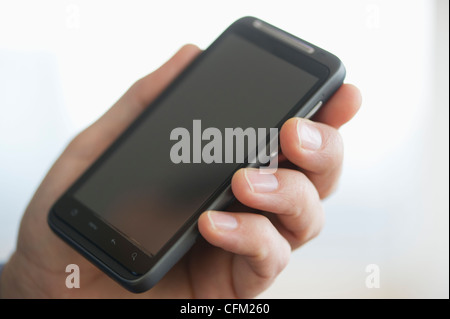 Jersey City, New Jersey, Nahaufnahme von Unternehmer Händen mit PDA Stockfoto