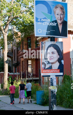 Die Quebec Parlamentswahlen 2012 sollen in der kanadischen Provinz Quebec am 4. September 2012 stattfinden. Große politische Parteien haben die Schlacht begonnen, auf die Straßen mit Werbeplakaten Fotografien rund um die Stadt von Montreal-hier ein Poster von Quebec Solidaire Parti Quebecois hängen nebeneinander an der Park Avenue in Montreal Stockfoto