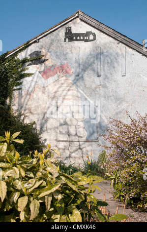 Der Mann mit dem Schwein an der Wand Kippax (Herr Kershaw) Stockfoto