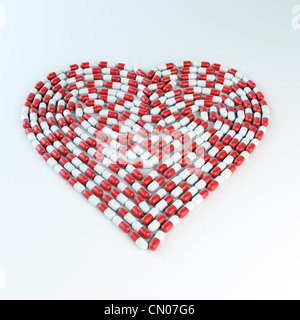 Rote und weiße Kapseln bilden eine Herzform - Kardiologie-Konzept Stockfoto