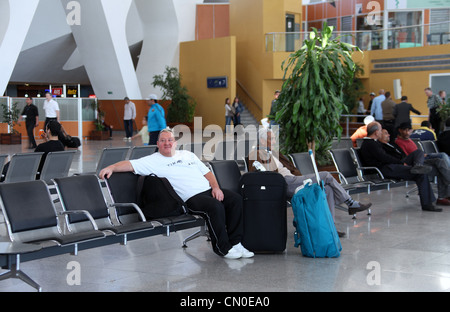 Passagiere am Flughafen Stockfoto