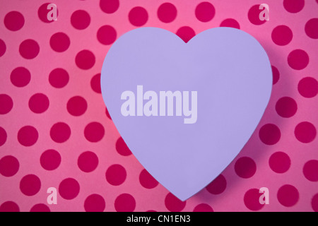 Purple Heart auf rosa Hintergrund Stockfoto