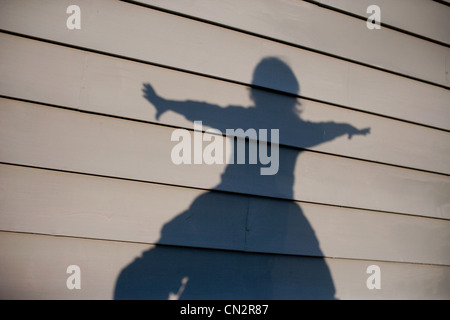 Des Kindes Schatten auf Haus Stockfoto