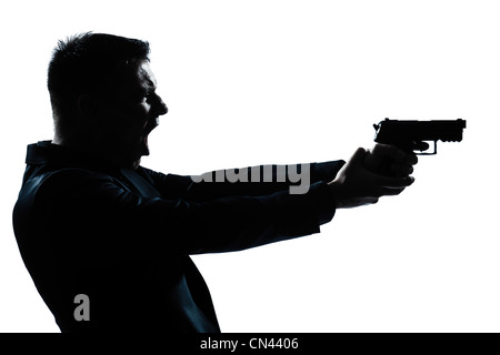 Kaukasische Spion kriminelle Polizisten detective Einmann Pistole Porträt Silhouette in weißem Hintergrund Studio isoliert halten Stockfoto