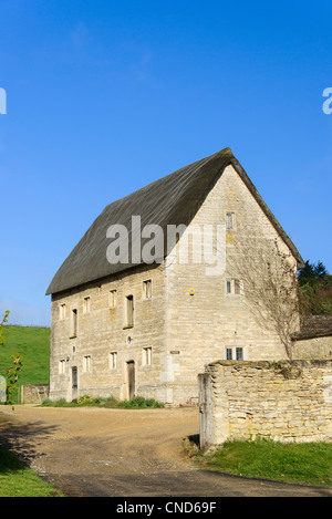 Frühen 17. große Gebäude aus Stein mit Reetdach Tackley Oxfordshire UK Stockfoto