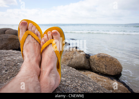 Füße hoch am Strand Stockfoto