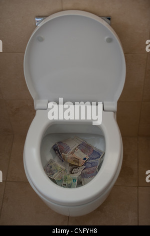 Geld hinunter die Toilette in Bezug auf die Finanzkrise und die
