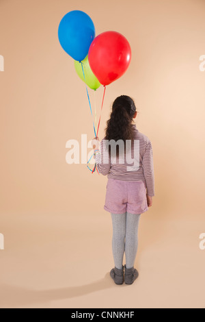 Mädchen mit Luftballons Stockfoto