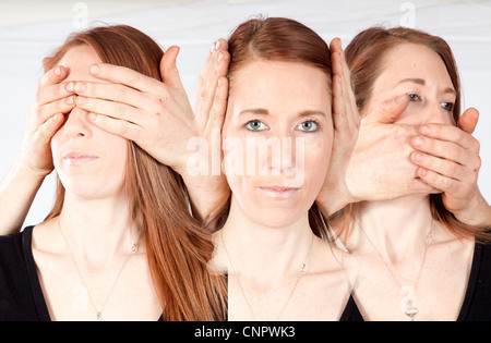 Sehen Sie nichts Böses, hören Sie nichts Böses, sprechen Sie keine böse, hübsche Frau mit Augen, Ohren und Mund bedeckt in eine Mehrfachbelichtung Stockfoto