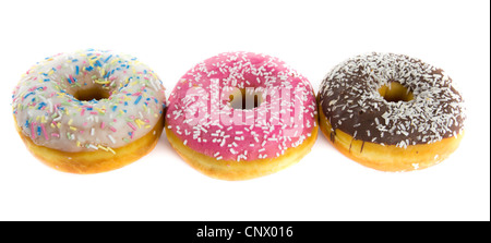 Bild von drei Donuts mit Schokolade, Erdbeere und Vanille Zuckerguss Stockfoto