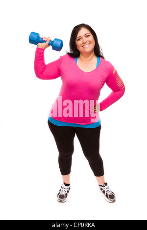 Attraktive applying Hispanic Frau In Trainingskleidung heben der Hantel vor einem weißen Hintergrund. Stockfoto