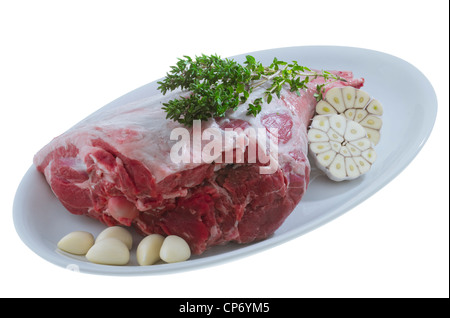 Rohe Lammkeule mit Thymian und Knoblauch Stockfoto