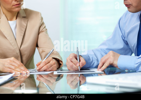 Geschäftspartner, die Notizen am seminar Stockfoto