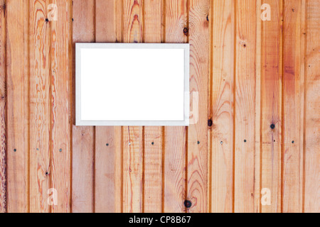 Hing an der alten gelben ländlichen Heimat Wand Kiefer Holz Dielen leeren weißen Fotorahmen Stockfoto