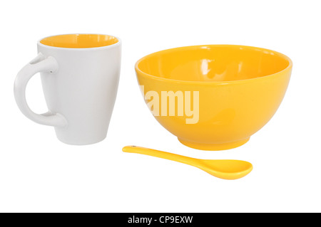 Frühstück-Set - Becher, Schüssel, Löffel gelb, isoliert auf weiss Stockfoto