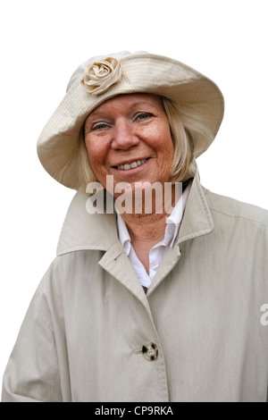 Ältere Frau mit rainclothes Stockfoto
