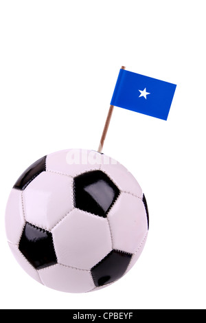 Soccerball oder Fußball verziert mit einer kleinen Nationalflagge auf einem toothstick Stockfoto