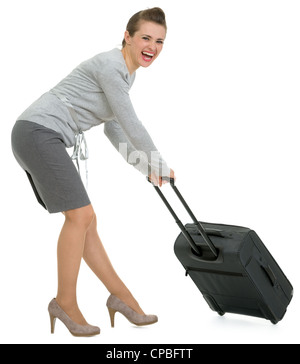 Müde Reisende Frau schleppen Koffer Stockfoto