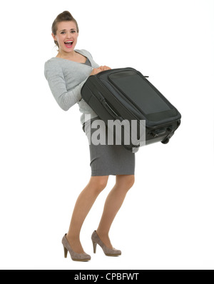 Müde Reisende Frau Anhebung Koffer Stockfoto