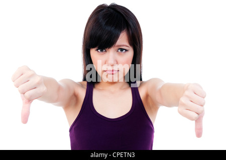 Aufgeregt junge Frau zeigt Daumen runter Zeichen Stockfoto