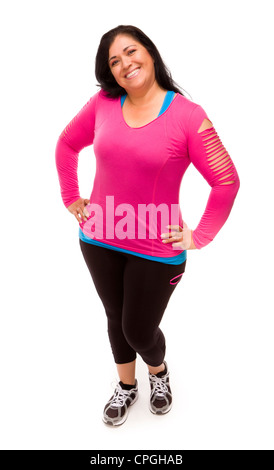 Attraktive applying Hispanic Frau In Trainingskleidung vor einem weißen Hintergrund. Stockfoto