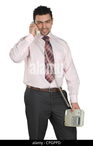 Junger Mann Festnetz telefonieren, Porträt Stockfoto