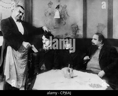 Eric Campbell, Charles Chaplin und Edna Purviance in "Einwanderer", 1917 Stockfoto