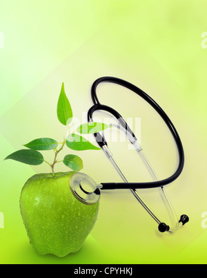 Gesundheit und Medizin-Hintergrund-Konzept mit Stethoskop und Green Apple wie ein Zeichen von Gesundheit Stockfoto