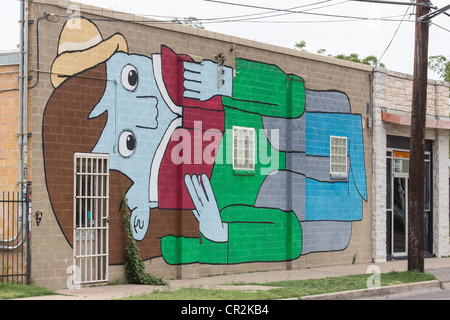 Ein Wandbild von einem riesigen Mann ein Buch an die Wand Domy Bücher in Austin, Texas Stockfoto