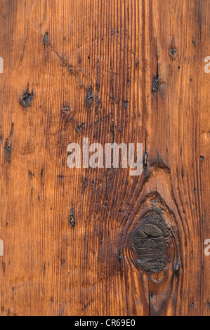 Holzmaserung mit einem Knoten-Loch, zerkratzt, Holzbrett, Details, Hintergrund Stockfoto