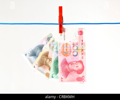 Fan von chinesischen Yuan oder Renminbi Banknoten, die Währung der Volksrepublik China, hängen, Wäscheleine, symbolische Stockfoto