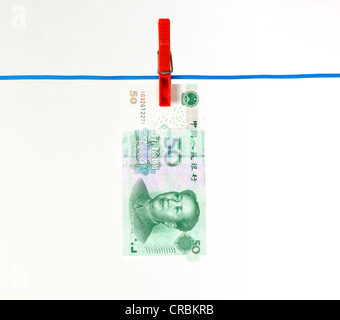 Chinesische Yuan, währten, Renminbi, der Währung der Volksrepublik China, Banknote auf einer Wäscheleine, symbolisches Bild für Geld Stockfoto