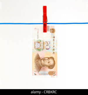 Chinesische Yuan, währten, Renminbi, der Währung der Volksrepublik China, Banknote auf einer Wäscheleine, symbolisches Bild für Geld Stockfoto