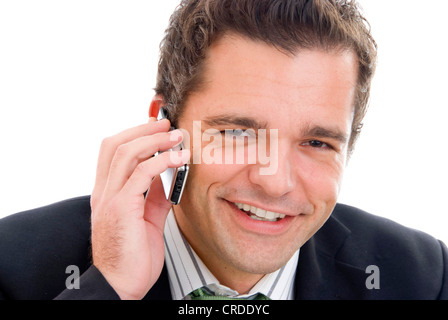 junger Geschäftsmann mit seinem Mobiltelefon Stockfoto