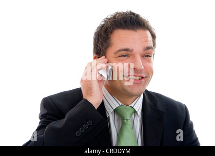 junger Geschäftsmann mit seinem Mobiltelefon Stockfoto
