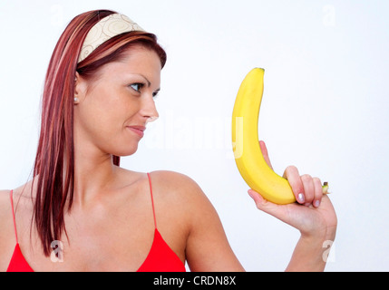 Frau mit Banane Stockfoto